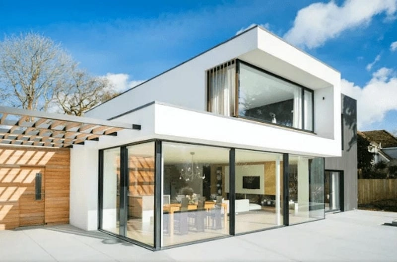 mẫu nhà 2 tầng cửa kính mở rộng tầm nhìn với không gian xanh